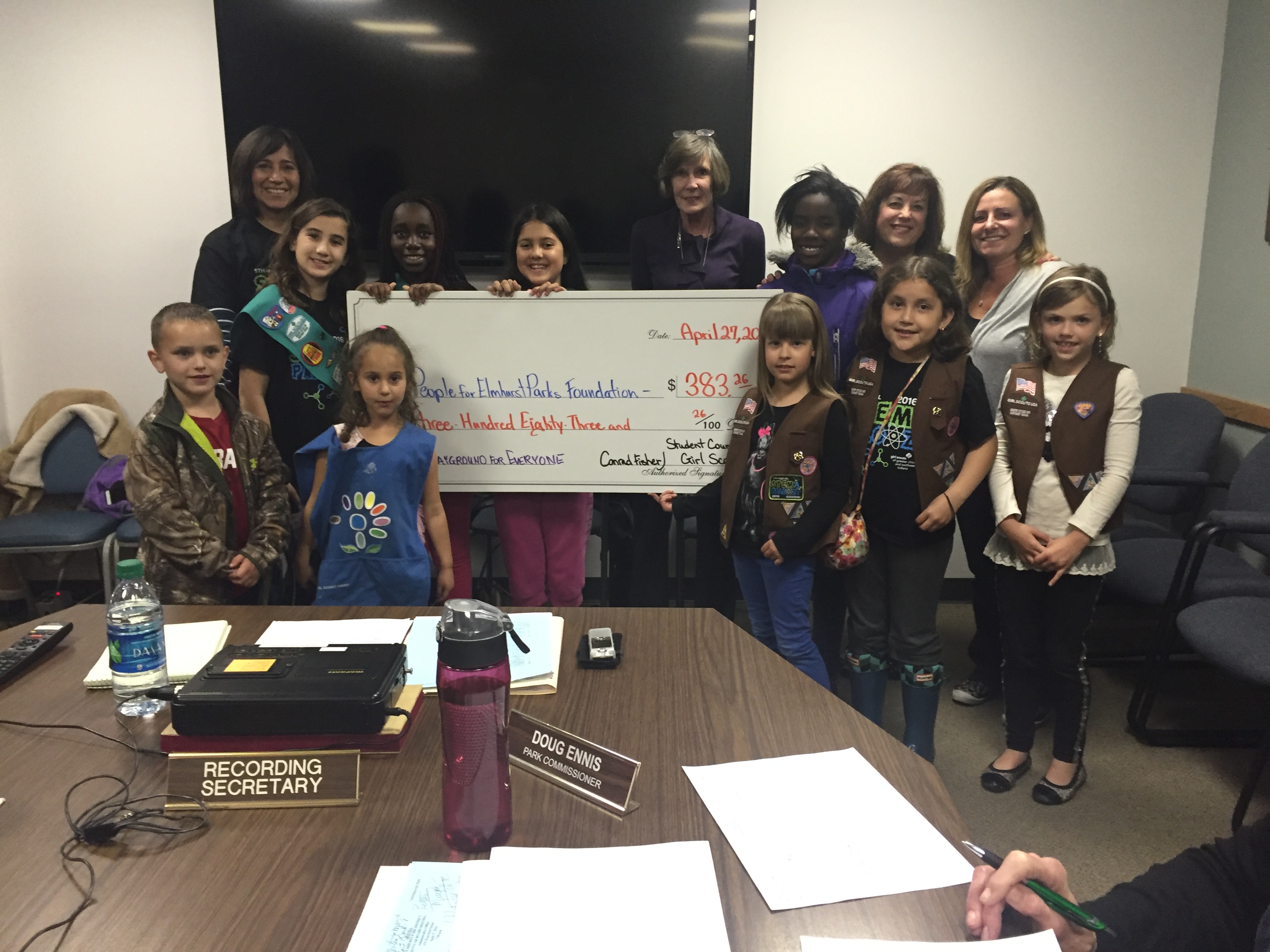 Fischer School Student Council and Girl Scout Members Present Check to