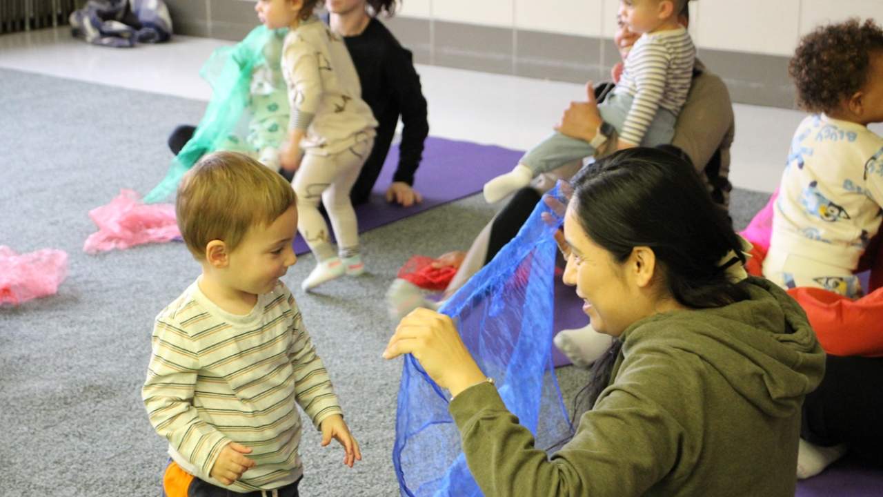 Early Childhood yoga class with caregiver