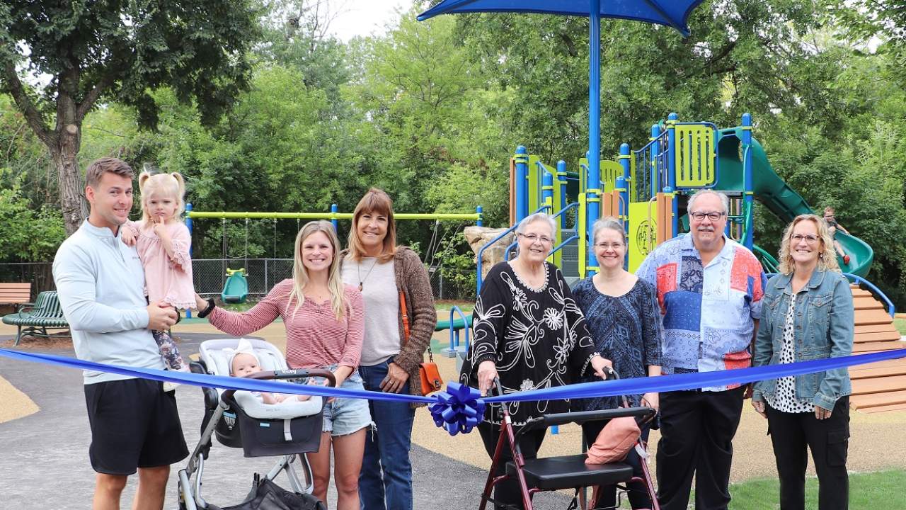 Ribbon cutting celebrates new Ben Allison Park playground, families at playground