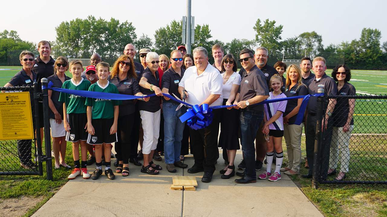 Elmhurst College President, Park District Executive Director and Elmhurst College staff celebrate ribbon cutting