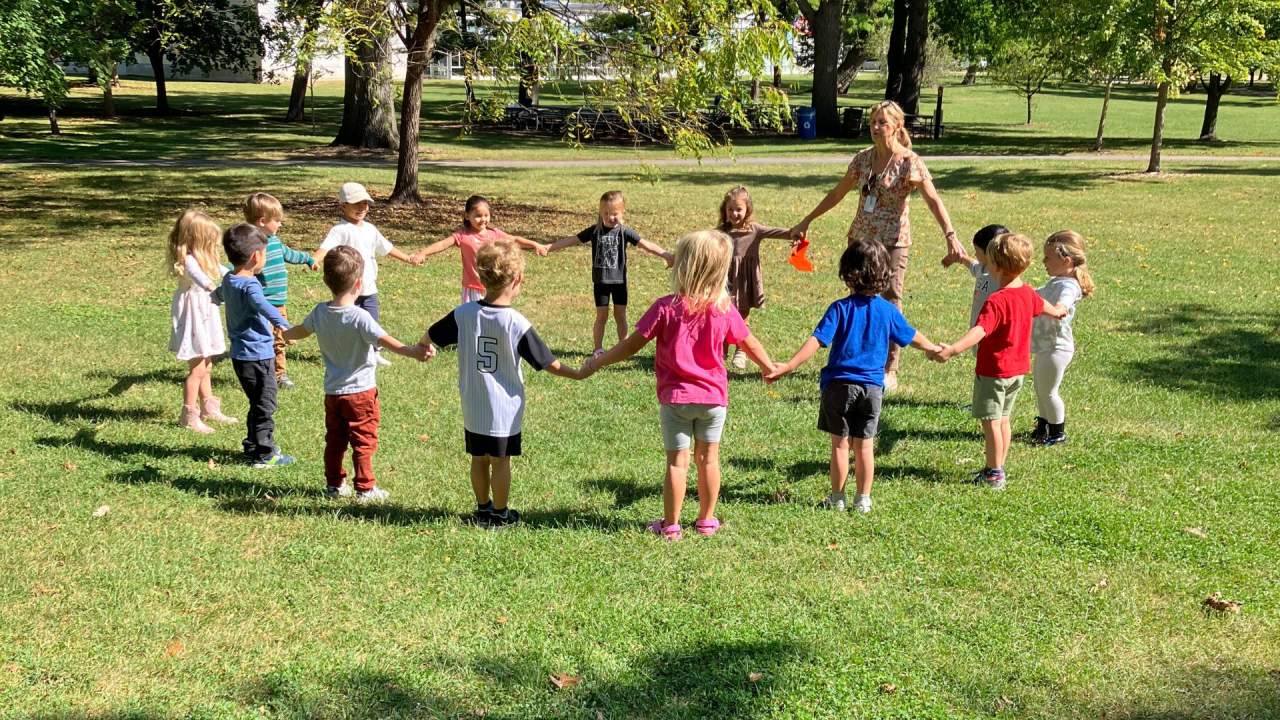 Preschoolers playing a game at the park