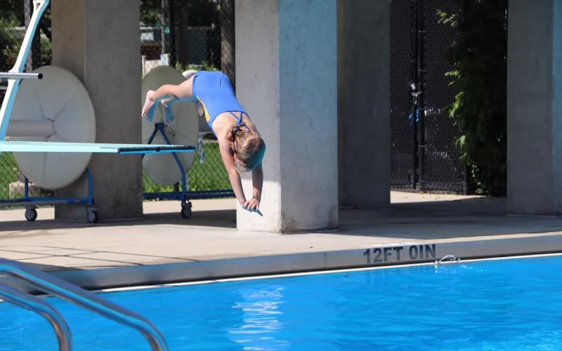 girl diving into a pool