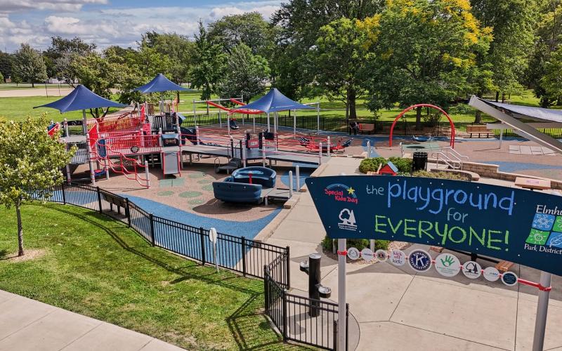 Overhead view of a playground with a sign titled The Playground for Everyone