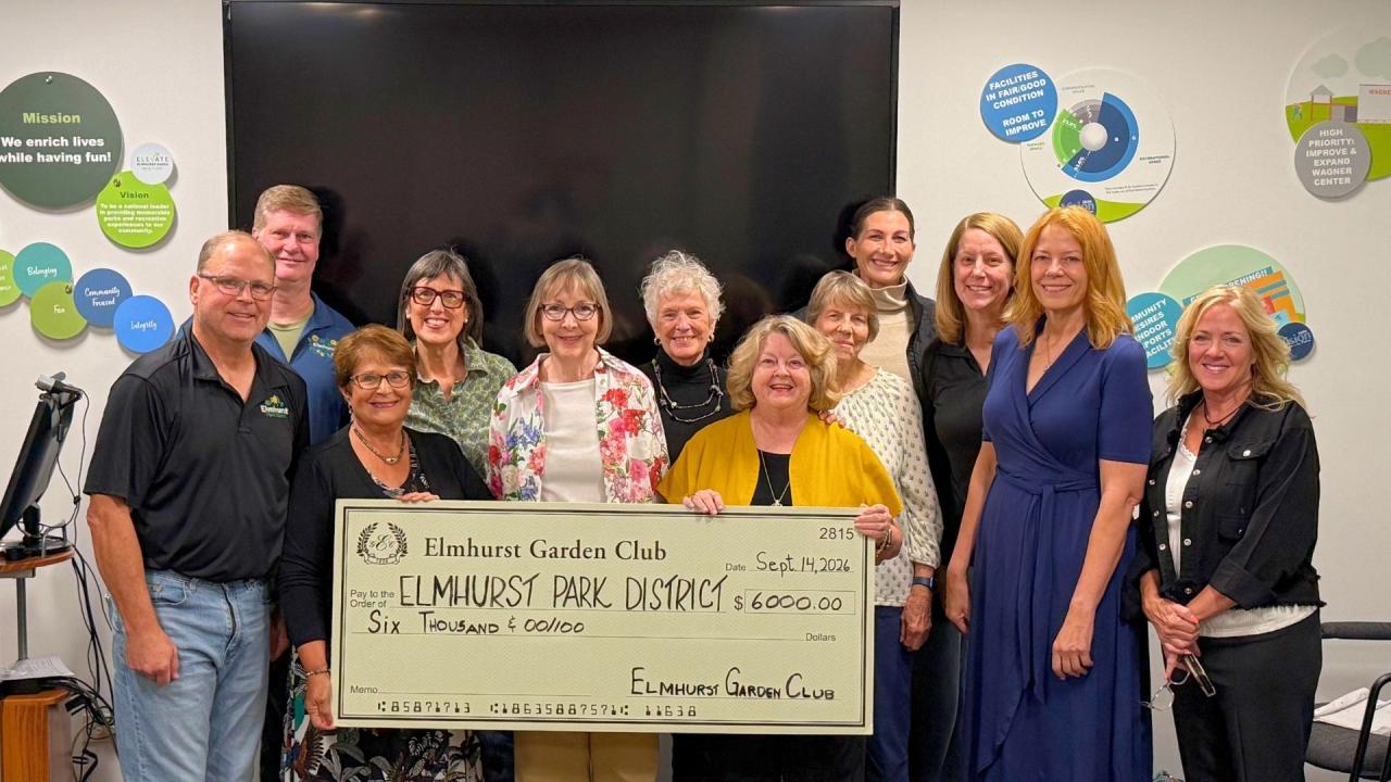 Group of people standing with a giant display check made out for six thousand dollars to Elmhurst Park District from the Elmhurst Garden Club.